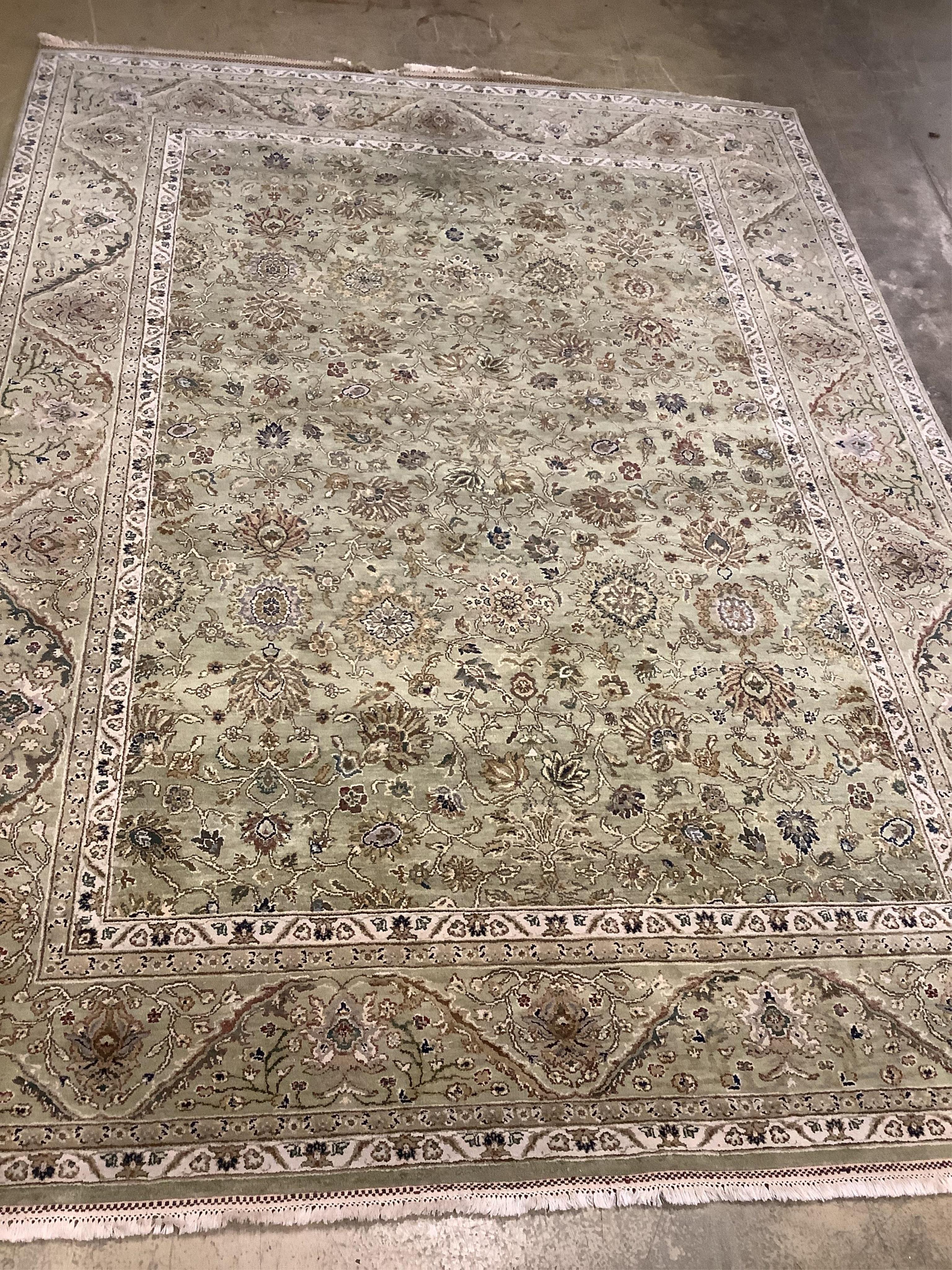 A North West Persian pale green ground carpet, approx. 380 x 280cm. Condition - good